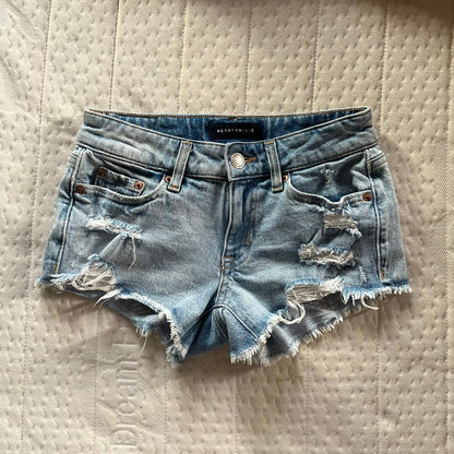 Distressed low rise denim shorts