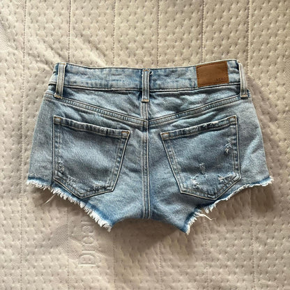 Distressed low rise denim shorts
